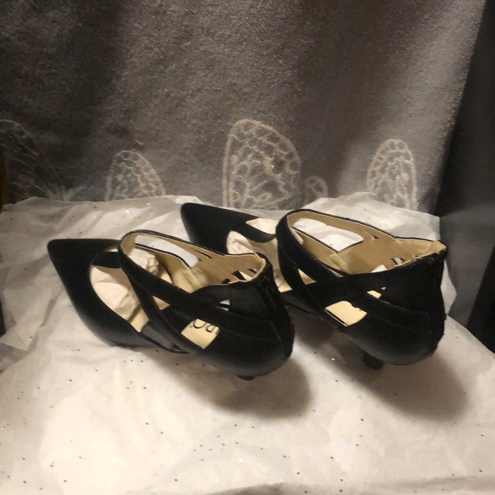 Black pointed toe heels.  They zip in the back